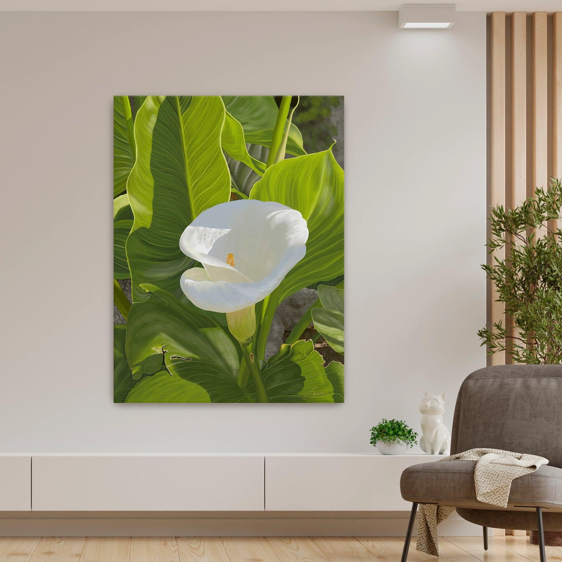 Peaceful modern living room featuring a sun-kissed white calla lily canvas art by Lisane Art, contrasted beautifully by bright green intricate foliage - displayed as a gallery-wrapped unframed canvas.