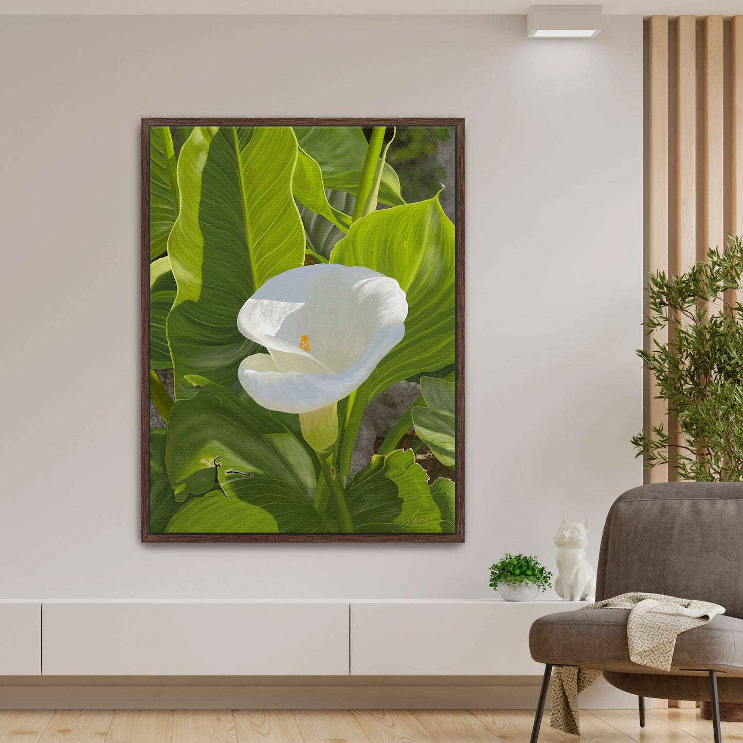 Peaceful modern living room featuring a sun-kissed white calla lily canvas art by Lisane Art, contrasted beautifully by bright green intricate foliage - framed in a deep espresso floating frame, adding rich sophistication.