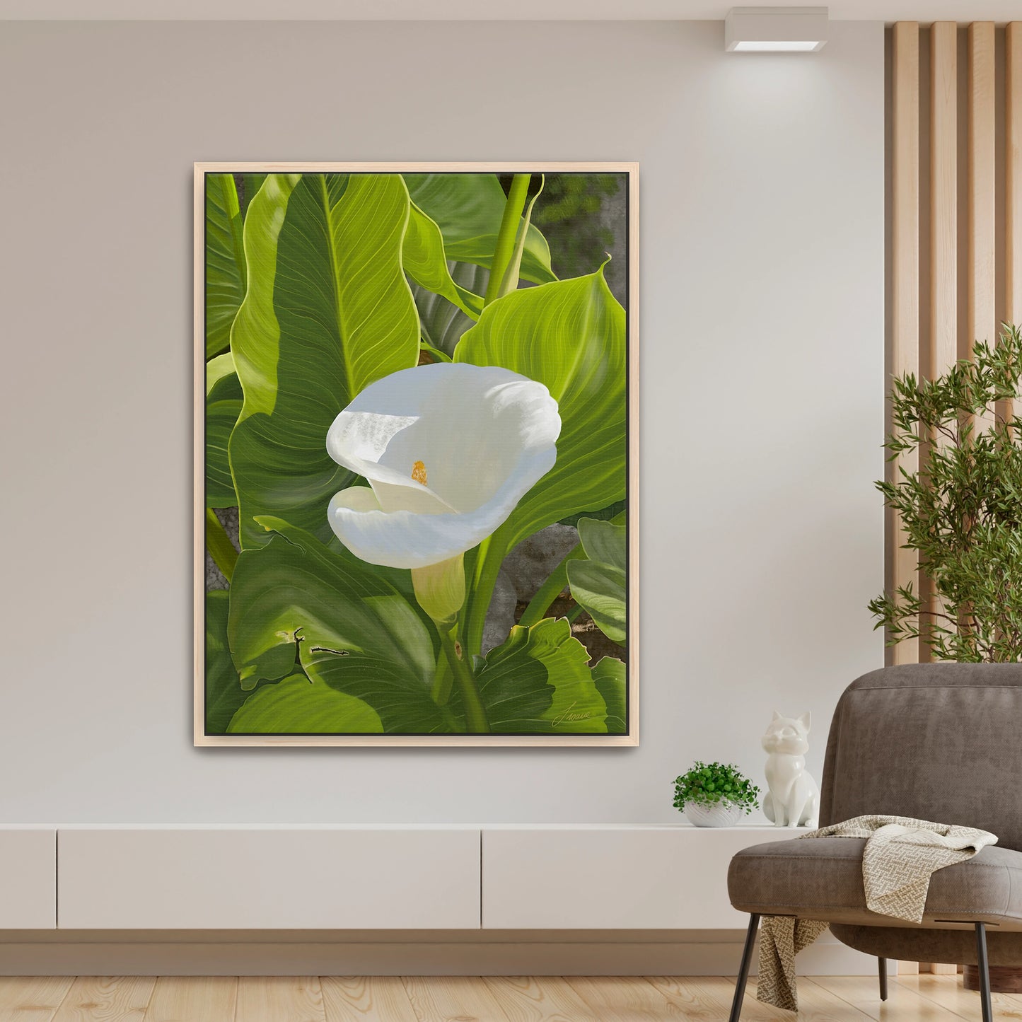 Peaceful modern living room featuring a sun-kissed white calla lily canvas art by Lisane Art, contrasted beautifully by bright green intricate foliage - framed in natural maple wood for a warm, organic touch.
