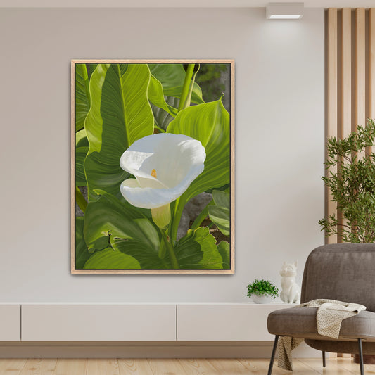 Peaceful modern living room featuring a sun-kissed white calla lily canvas art by Lisane Art, contrasted beautifully by bright green intricate foliage - set in a rich oak floating frame, blending nature and elegance.