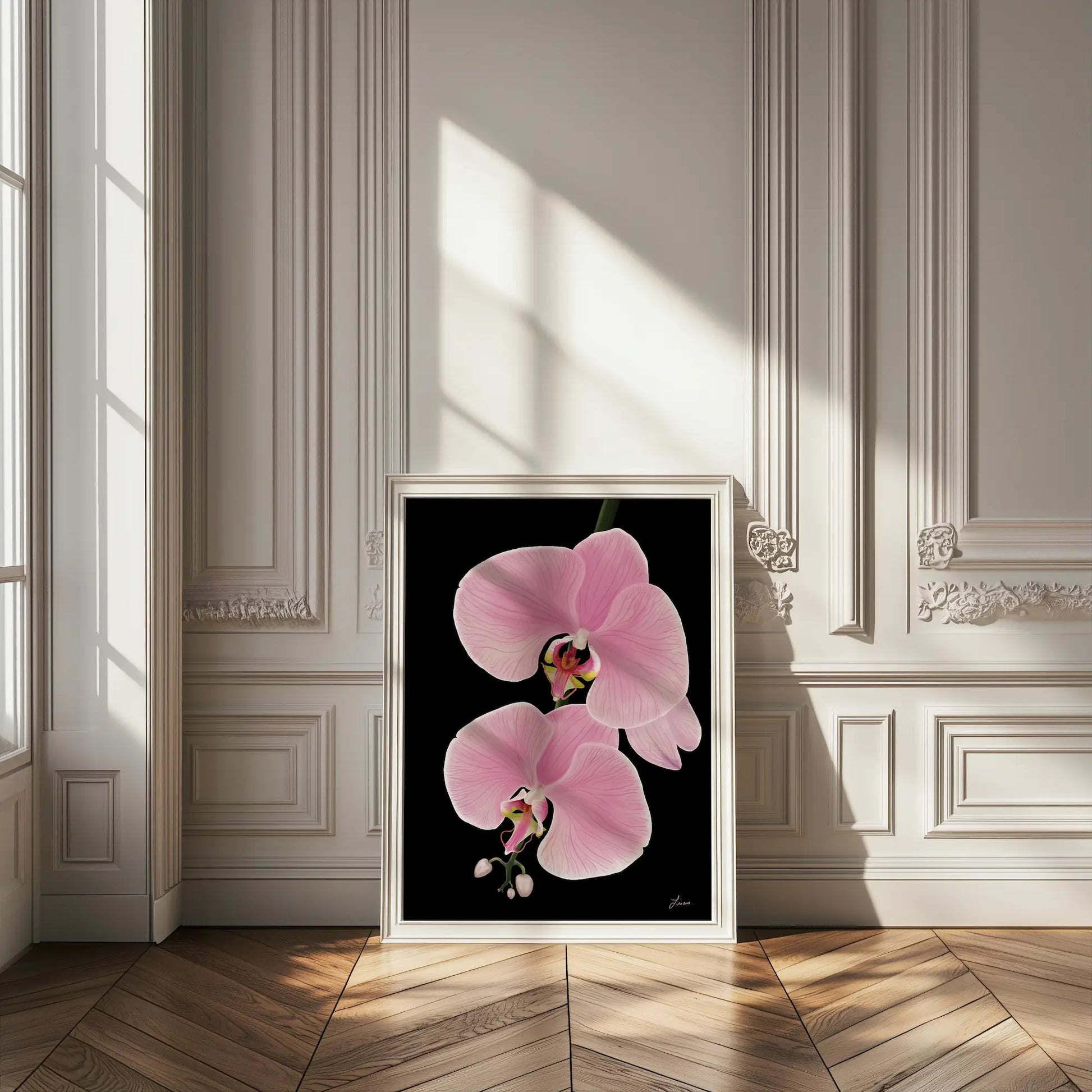 A framed painting titled Midnight Bloom features two pink orchid flowers on a black background, standing on a herringbone wooden floor in an elegant room with ornate white walls and sunlight streaming through tall windows.