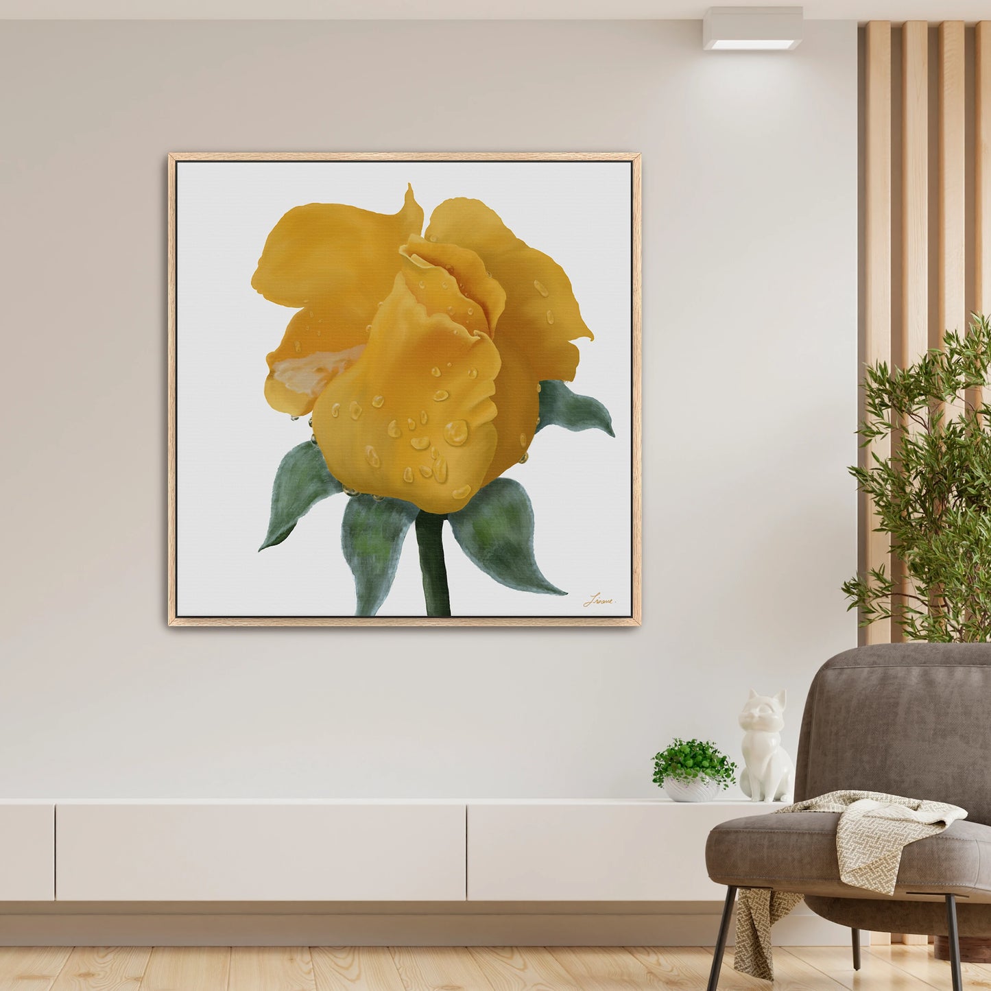 A modern living room with a vibrant yellow rose canvas art print covered in water droplets on the wall. The room features neutral decor, a gray chair, white cabinet, small green plant, and a white cat figurine. Warm lighting highlights the artwork.