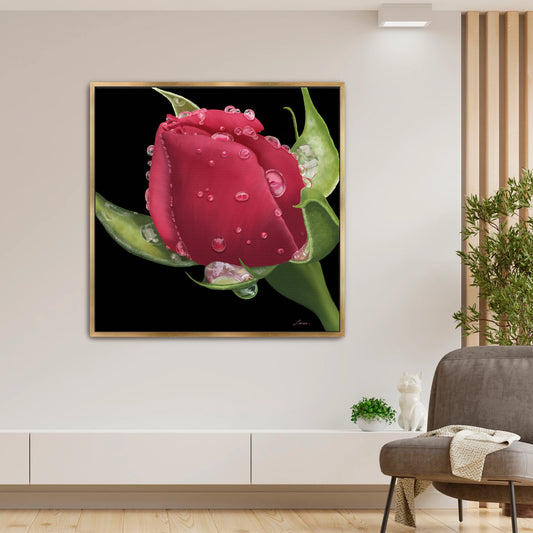 Elegant living room styled with a bold red rose canvas art by Lisane Art, convered in dewy raindrops and set against a dramatic black backdrop - elegantly framed in a luxurious gold floating frame. 